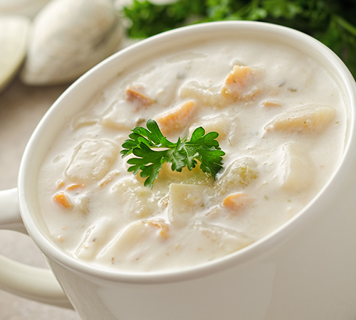 New england, creamy chowder in the white bowl